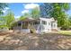 Charming single-story home with a well-maintained lawn, a porch, and lots of natural light at 106 Circle Dr, Mebane, NC 27302