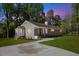 Beautiful home with a freshly painted facade, brick details, and a well-manicured lawn at 106 Circle Dr, Mebane, NC 27302