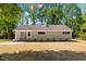 Charming single-story home with well-maintained lawn and mature trees at 106 Circle Dr, Mebane, NC 27302