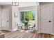 Bright sitting area with modern chairs next to the window and natural light at 106 Circle Dr, Mebane, NC 27302