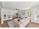 Comfortable living room featuring a fireplace and natural light from large windows at 106 Circle Dr, Mebane, NC 27302