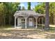 Charming backyard outbuilding with decorative trim, perfect for a studio or retreat at 106 Circle Dr, Mebane, NC 27302