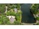 Overhead view featuring the home nestled between a tranquil lake and lush greenery at 116 Hibiscus Dr, Clayton, NC 27527