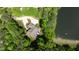 Stunning aerial view of the home with lush greenery and lake views at 116 Hibiscus Dr, Clayton, NC 27527