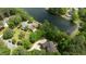 Aerial view of homes bordering the lake, surrounded by lush trees, and offering picturesque settings at 116 Hibiscus Dr, Clayton, NC 27527