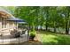 Spacious patio with outdoor seating and serene lake views at 116 Hibiscus Dr, Clayton, NC 27527