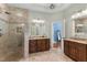 Spacious bathroom with dual sinks, granite counters, and a glass enclosed shower at 116 Hibiscus Dr, Clayton, NC 27527