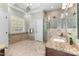 Bathroom featuring tile flooring, granite counters and a large glass enclosed shower at 116 Hibiscus Dr, Clayton, NC 27527