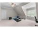 Bonus room featuring carpet flooring, a ceiling fan, and workout equipment for a versatile fitness space at 116 Hibiscus Dr, Clayton, NC 27527