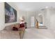 Bonus room with comfortable sofa and carpet, adjacent to staircase at 116 Hibiscus Dr, Clayton, NC 27527