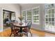 Bright dining area with wood floors and natural light from large windows at 116 Hibiscus Dr, Clayton, NC 27527