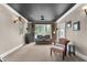 Spacious home theater with comfortable seating and multiple windows at 116 Hibiscus Dr, Clayton, NC 27527