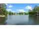 Scenic view of the lake showcasing lush greenery and residences across the water at 116 Hibiscus Dr, Clayton, NC 27527