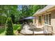 Outdoor patio featuring a dining set, offering a relaxing space with views of the landscaped backyard at 116 Hibiscus Dr, Clayton, NC 27527