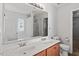 Bright bathroom features dual sinks, a large mirror and separate shower and tub at 1230 Sunday Silence Dr, Knightdale, NC 27545