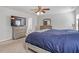 Spacious bedroom features neutral carpet, large window, ceiling fan and furniture at 1230 Sunday Silence Dr, Knightdale, NC 27545