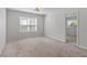 Well-lit bedroom with a large window and a doorway, offering a comfortable space at 1230 Sunday Silence Dr, Knightdale, NC 27545