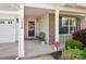 Inviting front porch with space for seating and brick accent, enhancing the home's curb appeal at 1230 Sunday Silence Dr, Knightdale, NC 27545
