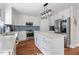 Bright kitchen with white cabinets, stainless steel appliances, and a center island at 1230 Sunday Silence Dr, Knightdale, NC 27545