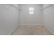 Spacious walk-in closet with a window and wire shelving, perfect for organizing clothes and accessories at 1230 Sunday Silence Dr, Knightdale, NC 27545