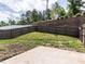 Fenced-in backyard with a small concrete area, offering a private outdoor space at 1242 Underbrush Dr, Durham, NC 27703