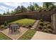 Beautifully landscaped backyard with privacy fence, stone path and space for entertaining at 1242 Underbrush Dr, Durham, NC 27703