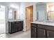 Bathroom showing double sinks, granite countertops, tile flooring, and a view of the closet and shower at 1242 Underbrush Dr, Durham, NC 27703