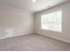 Bedroom with carpet and a window with blinds at 1242 Underbrush Dr, Durham, NC 27703