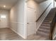 Inviting foyer with wood flooring, staircase, and access to the upper level at 1242 Underbrush Dr, Durham, NC 27703