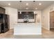 Updated kitchen featuring granite counters, stainless steel appliances, modern lighting and light wood flooring at 1242 Underbrush Dr, Durham, NC 27703