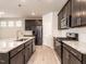 Stylish kitchen featuring an island, stainless steel appliances, and abundant cabinet space at 1242 Underbrush Dr, Durham, NC 27703