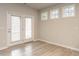 Bright living room with a door leading to the outside and decorative windows at 1242 Underbrush Dr, Durham, NC 27703