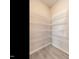 Walk-in pantry with wire shelving for organized storage space at 1242 Underbrush Dr, Durham, NC 27703