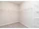 Walk-in closet features wire shelving and neutral carpeting, providing ample storage at 1242 Underbrush Dr, Durham, NC 27703