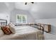 Charming bedroom featuring a window seat, soft lighting, and carpet flooring at 1276 Dalgarven Dr, Apex, NC 27502