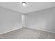 Spacious bedroom with soft neutral carpet and walls with white trim and baseboards at 1276 Dalgarven Dr, Apex, NC 27502