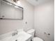 Clean half-bath features chrome fixtures, and a standard toilet at 13 Patriot Cir, Durham, NC 27704