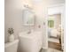Clean bathroom with white vanity, adjacent to a bright bedroom at 13 Patriot Cir, Durham, NC 27704
