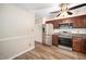 Kitchen area featuring stainless steel appliances, ample cabinetry, and modern vinyl flooring at 13 Patriot Cir, Durham, NC 27704