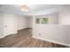 Spacious room with hard surface floors, neutral walls, and sliding glass doors to the outside at 13 Patriot Cir, Durham, NC 27704
