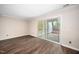 Open-concept living area boasts new floors and access to outdoor patio at 13 Patriot Cir, Durham, NC 27704