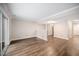 Open-concept living area boasts new floors and access to the front entryway at 13 Patriot Cir, Durham, NC 27704