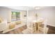 Bright living room with neutral decor, leading to a deck through sliding glass doors at 13 Patriot Cir, Durham, NC 27704