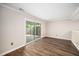 Open-concept living area boasts new floors and access to outdoor patio at 13 Patriot Cir, Durham, NC 27704