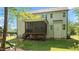 Back exterior view featuring a screened-in porch and a play area in a grassy backyard at 130 Hilldebrant Dr, Franklinton, NC 27525