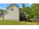 Home exterior showcases a back porch and manicured lawn, highlighting outdoor space and design at 130 Hilldebrant Dr, Franklinton, NC 27525