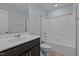Bathroom with vanity, sink, and shower/tub combo with light blue walls at 130 Hilldebrant Dr, Franklinton, NC 27525