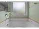 A soaking tub with a window providing natural light. Spa-like comfort for relaxation at 130 Hilldebrant Dr, Franklinton, NC 27525