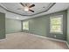 Large bedroom with ceiling fan, green walls, and two windows offering natural light at 130 Hilldebrant Dr, Franklinton, NC 27525