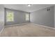 Neutral bedroom with two windows providing natural light and comfortable carpet at 130 Hilldebrant Dr, Franklinton, NC 27525